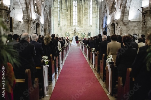 Wedding ceremony in a church, hallway behind