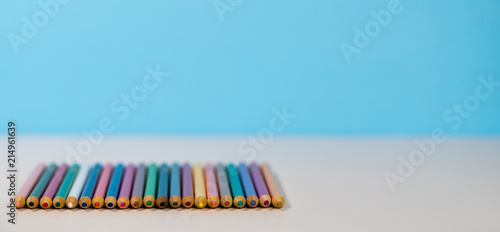 Stack of colorful pencils laid side by side with copy space © steheap