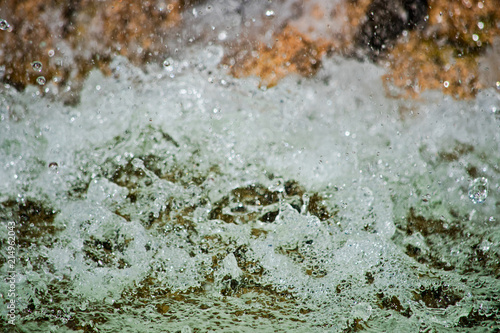 Water with spray and foam is macro © savelov