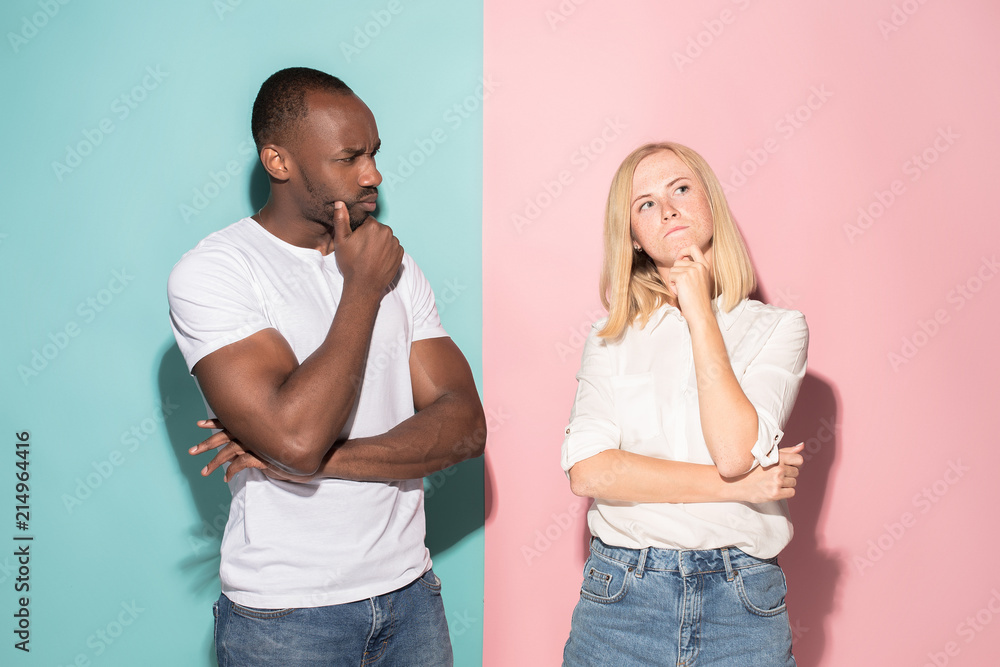 Young serious thoughtful businessman and woman. Doubt concept. Young serious thoughtful businessman and woman. Doubt concept.