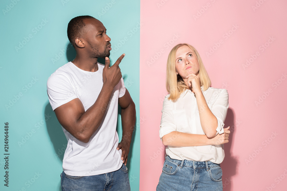 Young serious thoughtful businessman and woman. Doubt concept. Young serious thoughtful businessman and woman. Doubt concept.