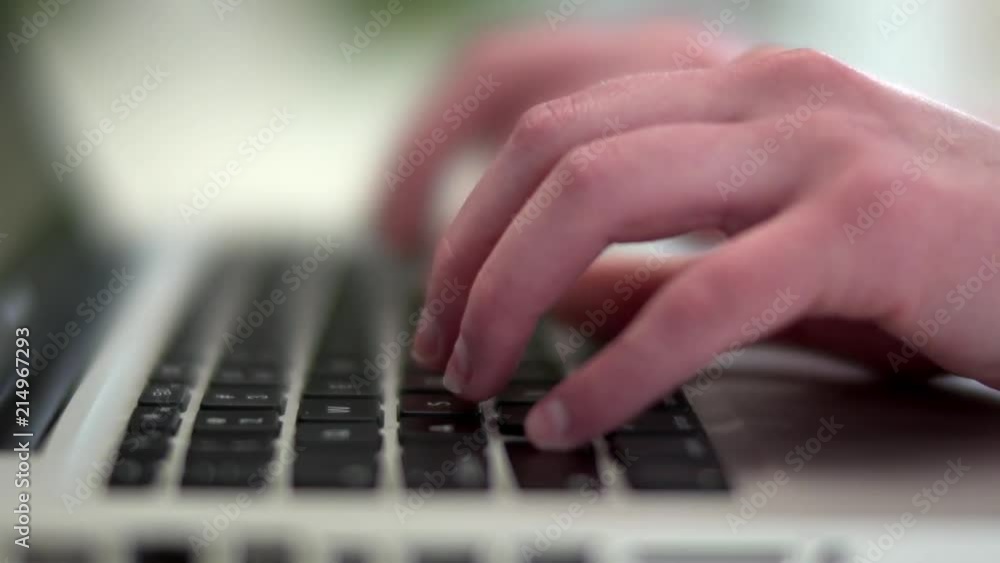 Female hands typing on a keyboard Female hands typing on a keyboard