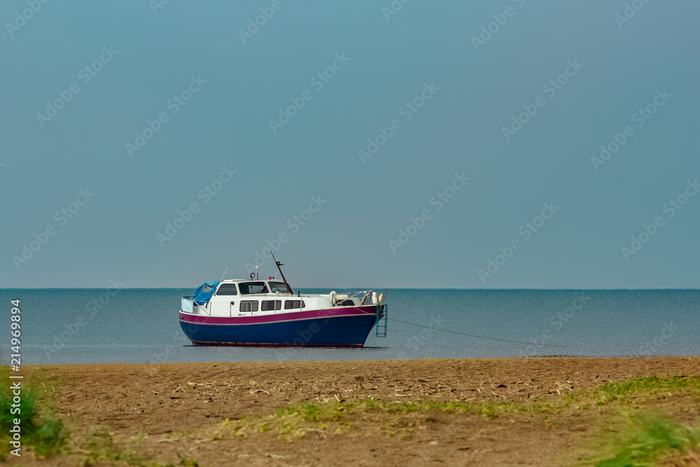 Fototapeta premium Small blue passenger ship