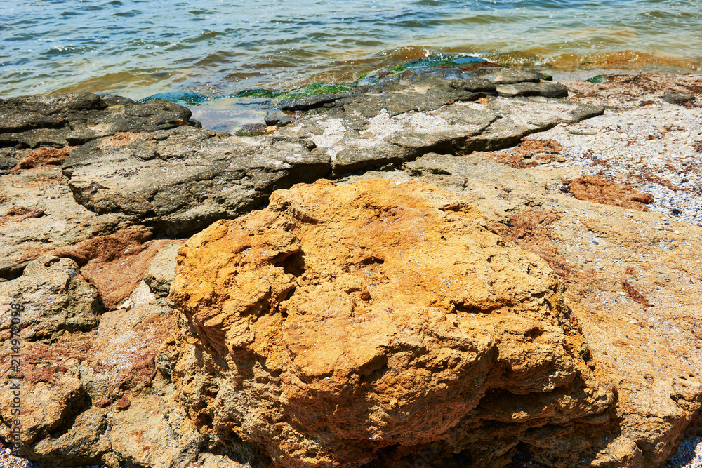 beautiful sea landscape, closeup of stone on the beach, sea coast with high hills, wild nature beautiful sea landscape, closeup of stone on the beach, sea coast with high hills, wild nature