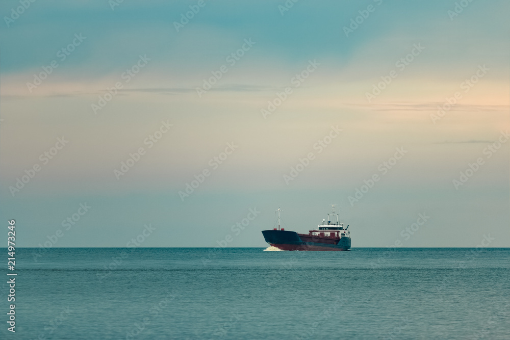 Blue cargo ship underway Blue cargo ship underway