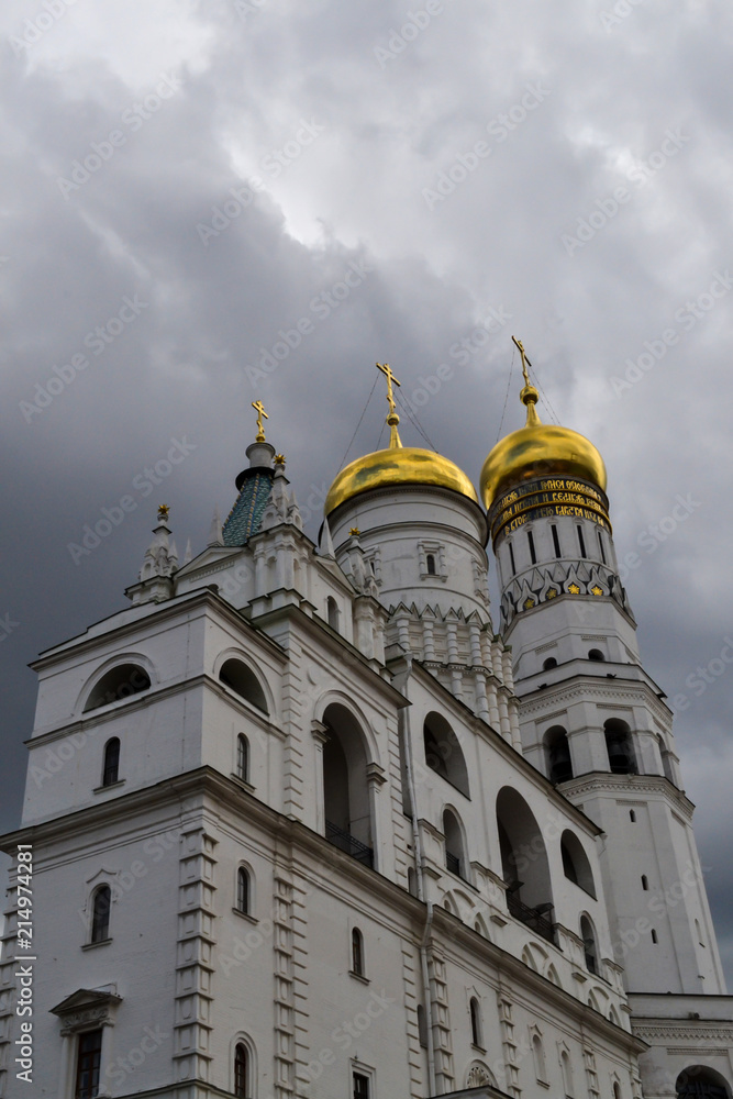 Inside the Moscow Kremlin. The bell tower of Ivan the Great against the background of thunderclouds.