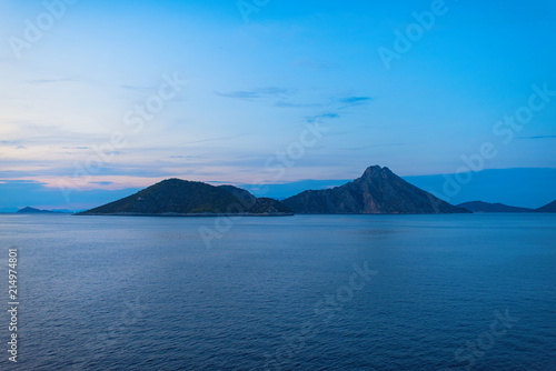 View of the Greek island of Atokos from the ferry at sunset. Greek islands in the Ionian Sea