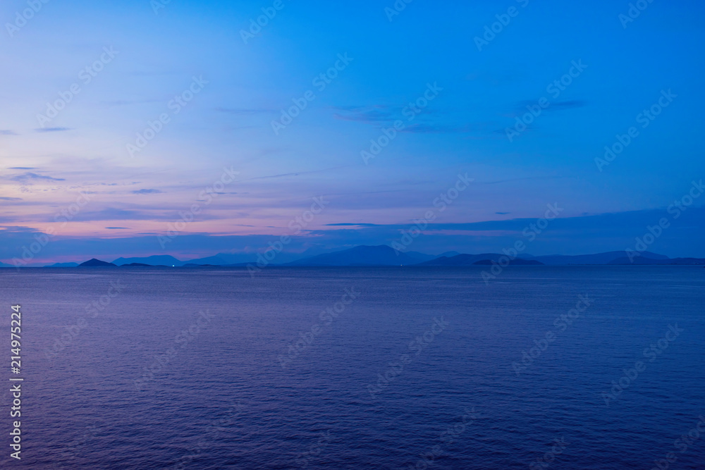View of the Greek islands of Ithaca and Kefalonia from the ferry ship at sunset. Greek islands in the Ionian Sea