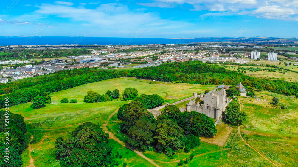 Aerial view over Craigmillar Castle and the city of Edinburgh