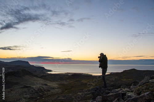 Photographer watching the sun set