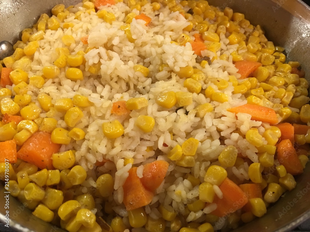 Closeup of Mexican rice in pot. Corn, peas, carrots visible Closeup of Mexican rice in pot. Corn, peas, carrots visible
