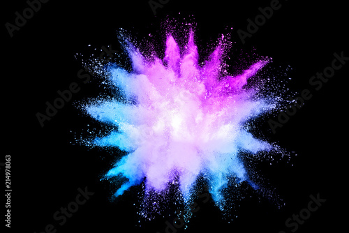 Freeze motion of color powder exploding on black background.