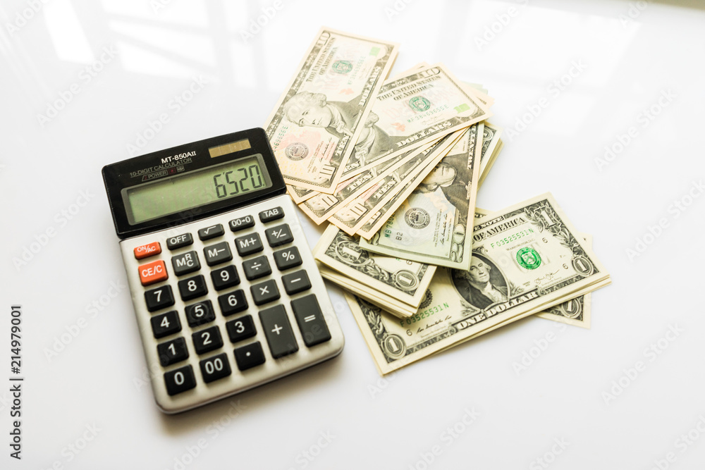 Close-up Money and Calculator, American Dollar Banknotes Close-up Money and Calculator, American Dollar Banknotes