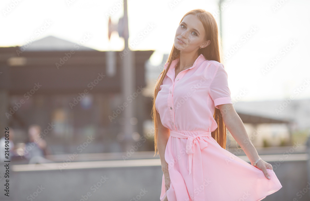 Portrait Of Young Smiling Beautiful Woman. Close-up portrait of a fresh and beautiful young fashion model posing outdoor. Summer outdoor portrait