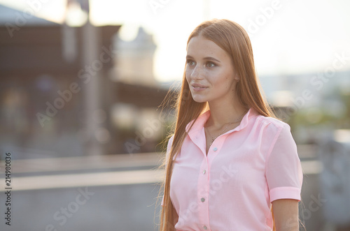 Fototapeta Naklejka Na Ścianę i Meble -  Portrait Of Young Smiling Beautiful Woman. Close-up portrait of a fresh and beautiful young fashion model posing outdoor. Summer outdoor portrait