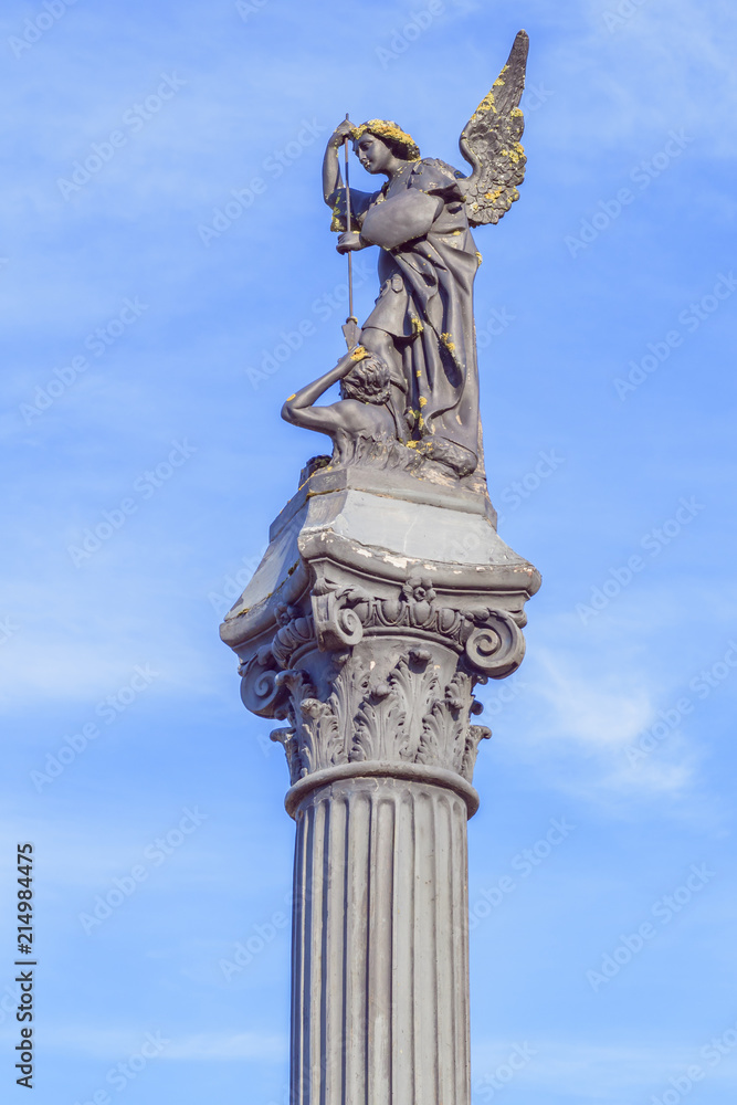Fototapeta premium The column with the archangel, which is in front of Church of the Holy Trinity in Gerviaty, Grodno region, Belarus