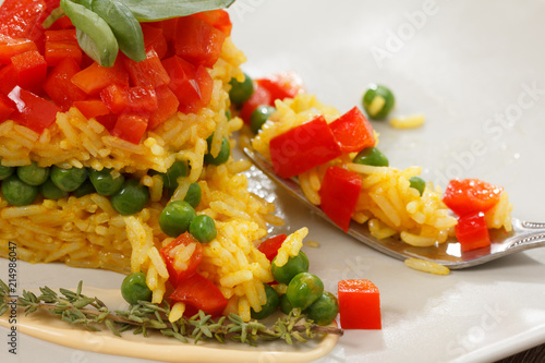 Healthy food. Rise basmati with vegetables. Vegan food. Basmati rice cooked white on wooden table.