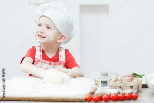 Boy with chef hat preparing...