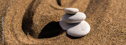 Canvas Print zen meditation stone in sand, concept for purity harmony and spirituality, spa w