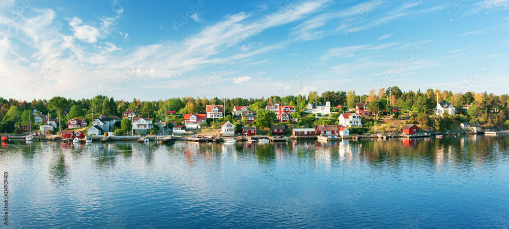 Small islands in the morning near to Stockholm. Swedish landscape with traditional red houses