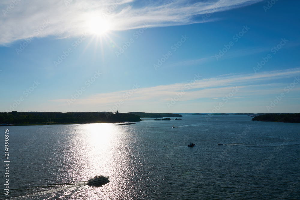 A boat in sunlight on a sunset. Backlight. Archipelago near Naantali, Finland. A boat in sunlight on a sunset. Backlight. Archipelago near Naantali, Finland.
