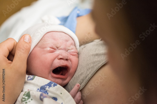 Mother holding newborn baby for the first time