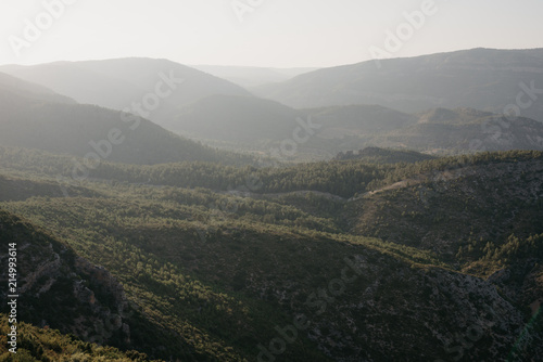 A lot of huge beautiful hills covered with forest in the evening in Spain