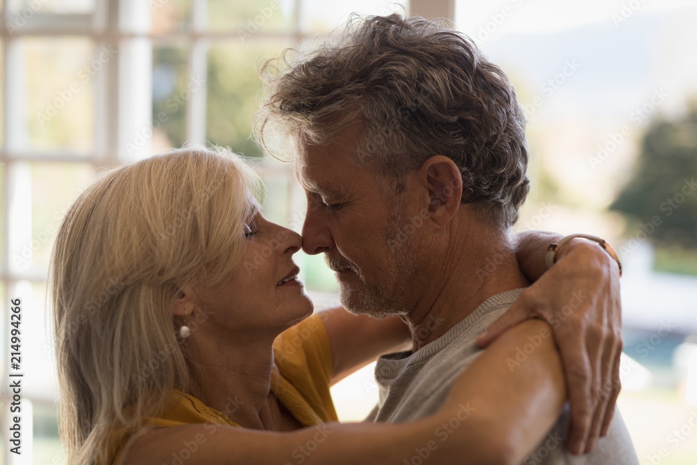 Romantic senior couple dancing together at home Romantic senior couple dancing together at home