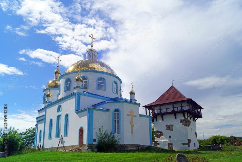 Orthodox Church and restored tower of ancient fortress  in village Busha, Vinnytsia Oblast, Ukraine