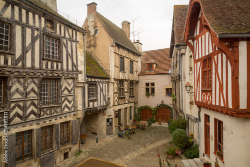 Square with half-timbered houses, in the medieval village Noyers-sur-Serein
