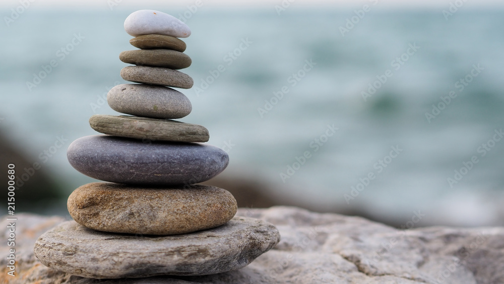 tower and blur background made of stones by the sea tower and blur background made of stones by the sea