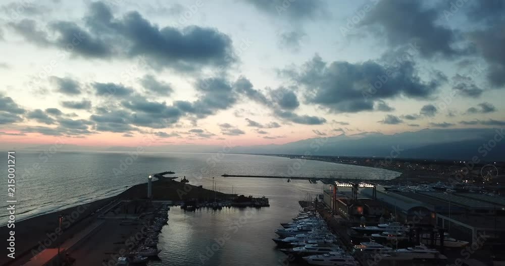 After sunset flight around seaport of Italy After sunset flight around seaport of Italy