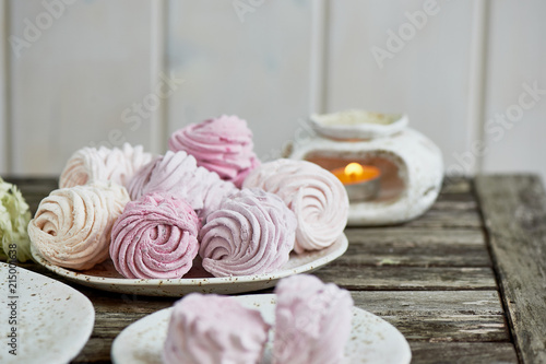 Delicate pastel colors. Tea party in the open air. Ceramics in a rustic style, handmade. Delicate marshmallow pink shades.