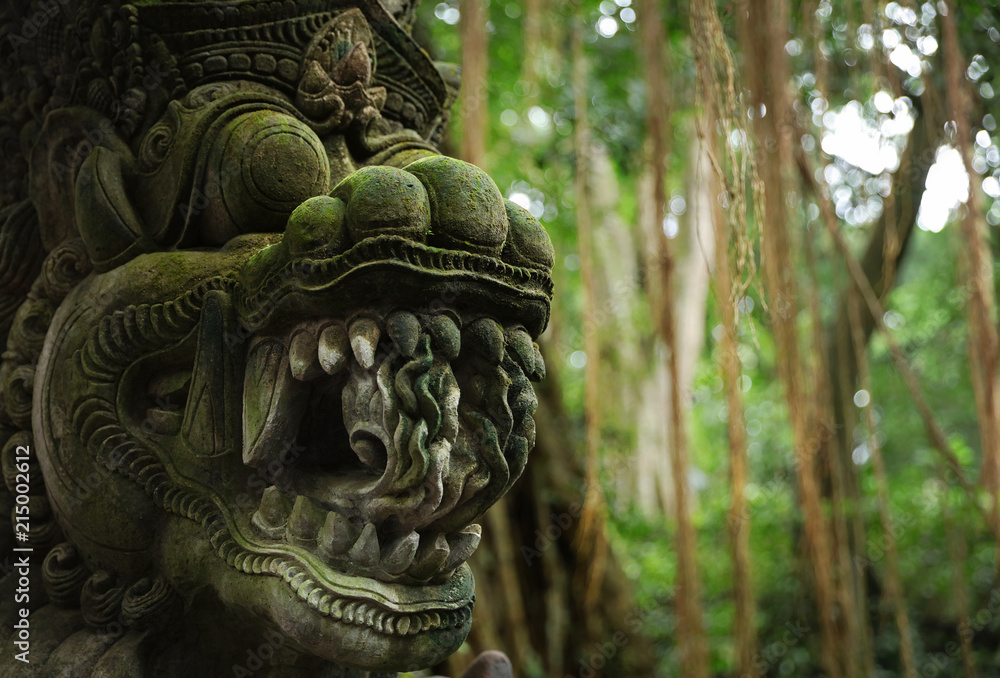 Balinese ancient stone sculpture. Bali, Indonesia.