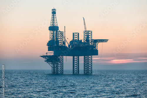 Offshore drilling rig at sunset