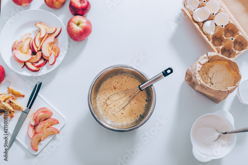 Ingredients and tools for cooking apple pie