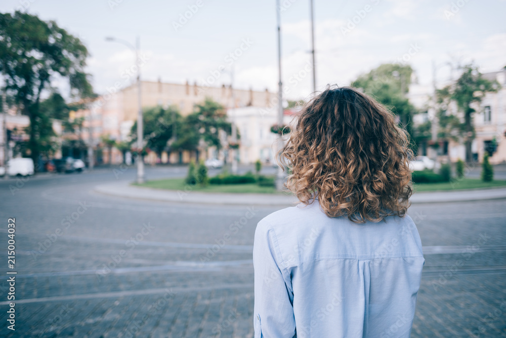Young woman with thick curly hair looking Young woman with thick curly hair looking