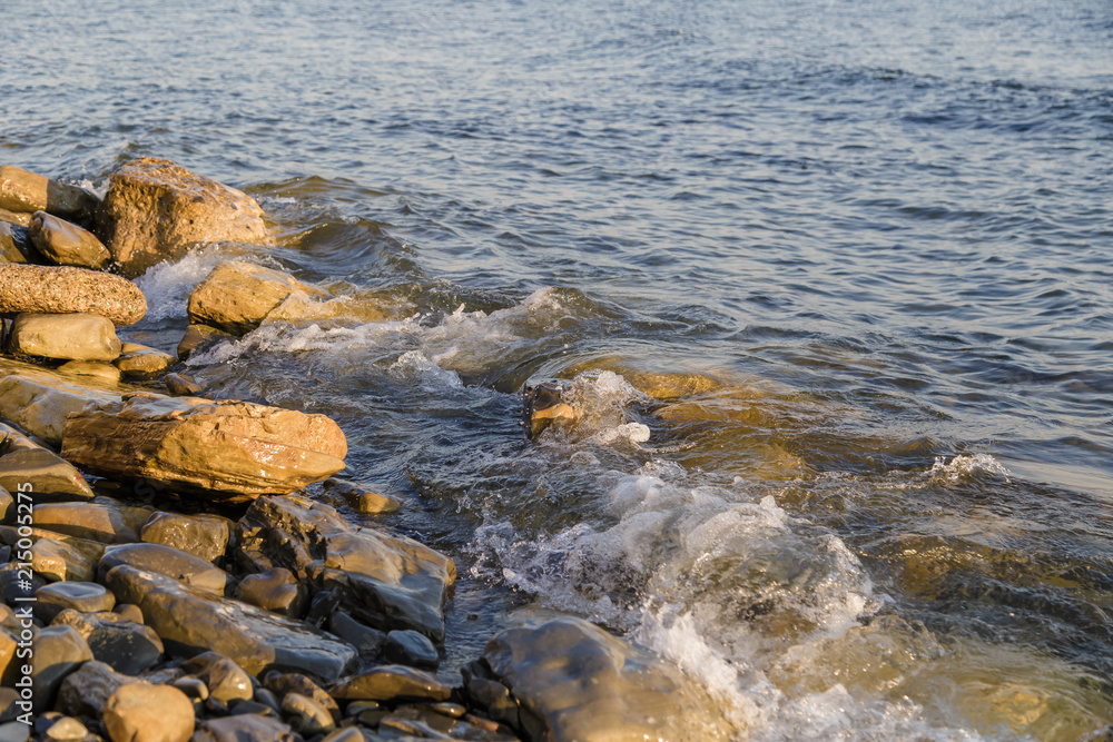 Sea waves are fighting against the big rocks on the shore. Sea waves are fighting against the big rocks on the shore.