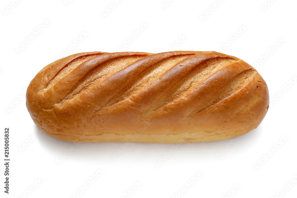 A loaf of fresh white wheat bread isolated on a white background. Top view