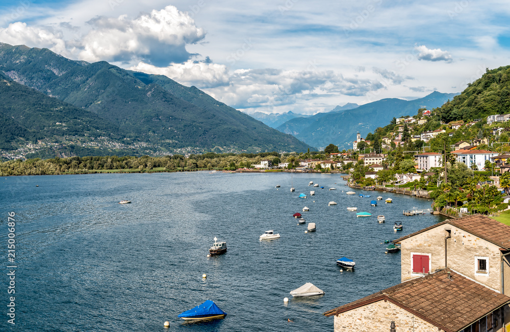 Obraz premium Landscape of Lake Maggiore with mountains and Magadino village in the background from Vira Gambarogno village, Ticino, Switzerland