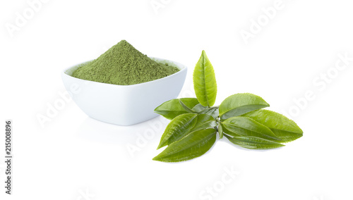 Powder green tea in cup with green tea leaf on white