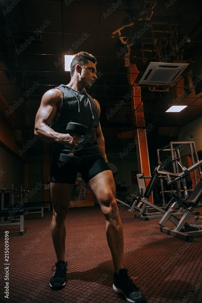 The man in the gym.Guy's training.The Sports Guy.Man's health The man in the gym.Guy's training.The Sports Guy.Man's health