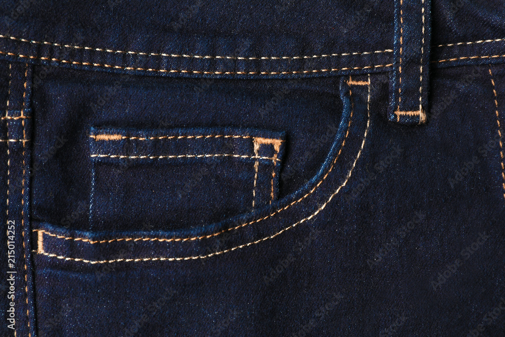 Closeup view of jeans pocket as background Closeup view of jeans pocket as background