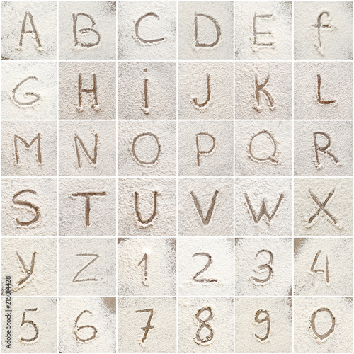 Set with letters and numbers written on scattered flour
