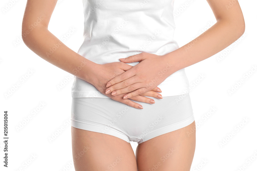 Young woman holding hands near underwear on white background. Gynecology Young woman holding hands near underwear on white background. Gynecology