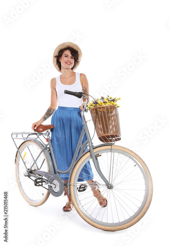 Portrait of beautiful young woman with bicycle on white background © New Africa