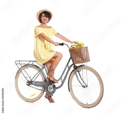 Portrait of beautiful young woman with bicycle on white background © New Africa