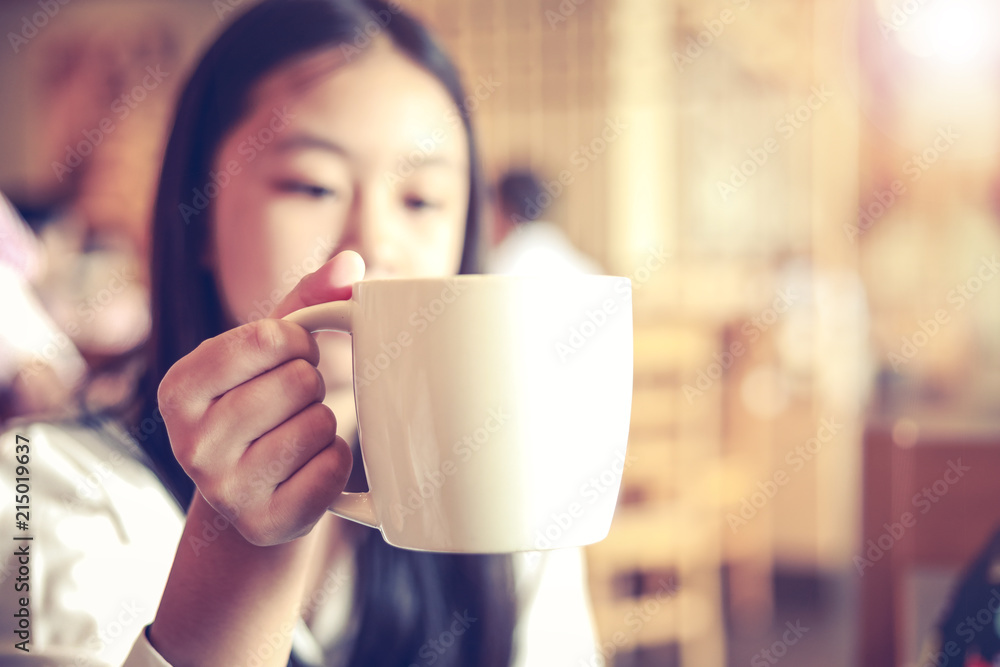 a cup of coffee in woman hand in the morning a cup of coffee in woman hand in the morning