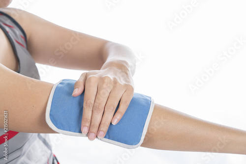 woman putting an ice pack on her arm or elbow pain, healthy concept
