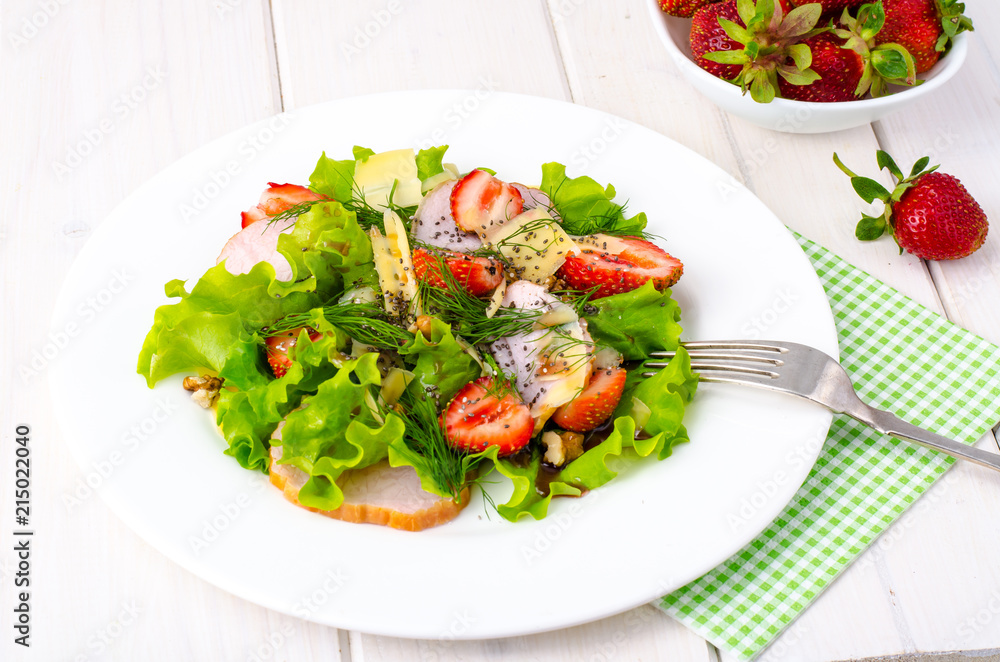 Vegetable salad with ham, strawberries, chia seeds